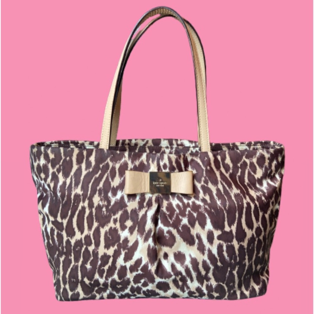 Kate Spade brown and tan shoulder bag with storybook lining.